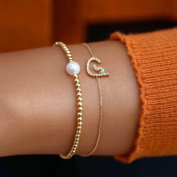 Armband Arabische Buchstaben 18K Gold und Diamanten