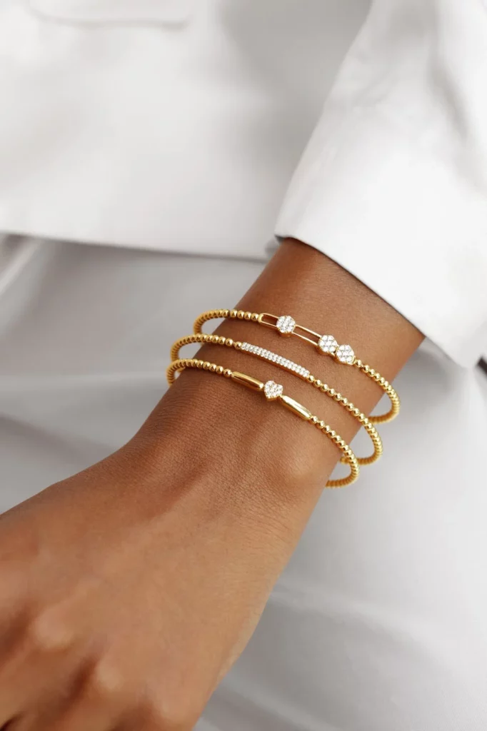 Add Sparkle To Your Evening Wear - Styling Tips- How Minimalist Gold And Diamond Bangle Bracelets Influence Everyday Fashion - Aquae Jewels - Exquisite Jewelry in 18k Gold & Diamonds | Dubai