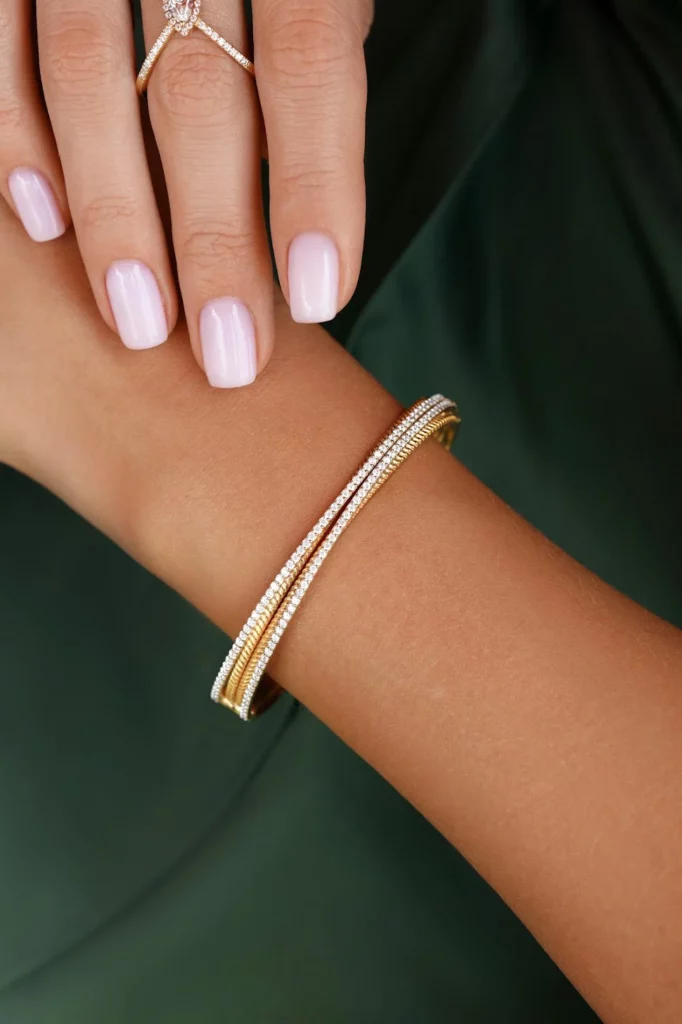 Go For A Solo Statement - Styling Tips- How Minimalist Gold And Diamond Bangle Bracelets Influence Everyday Fashion - Aquae Jewels - Exquisite Jewelry in 18k Gold & Diamonds | Dubai